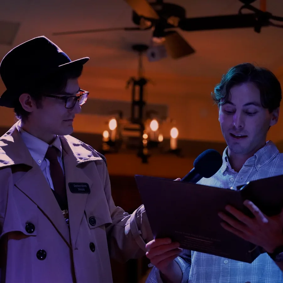 Professional actors performing at a Springfield murder mystery